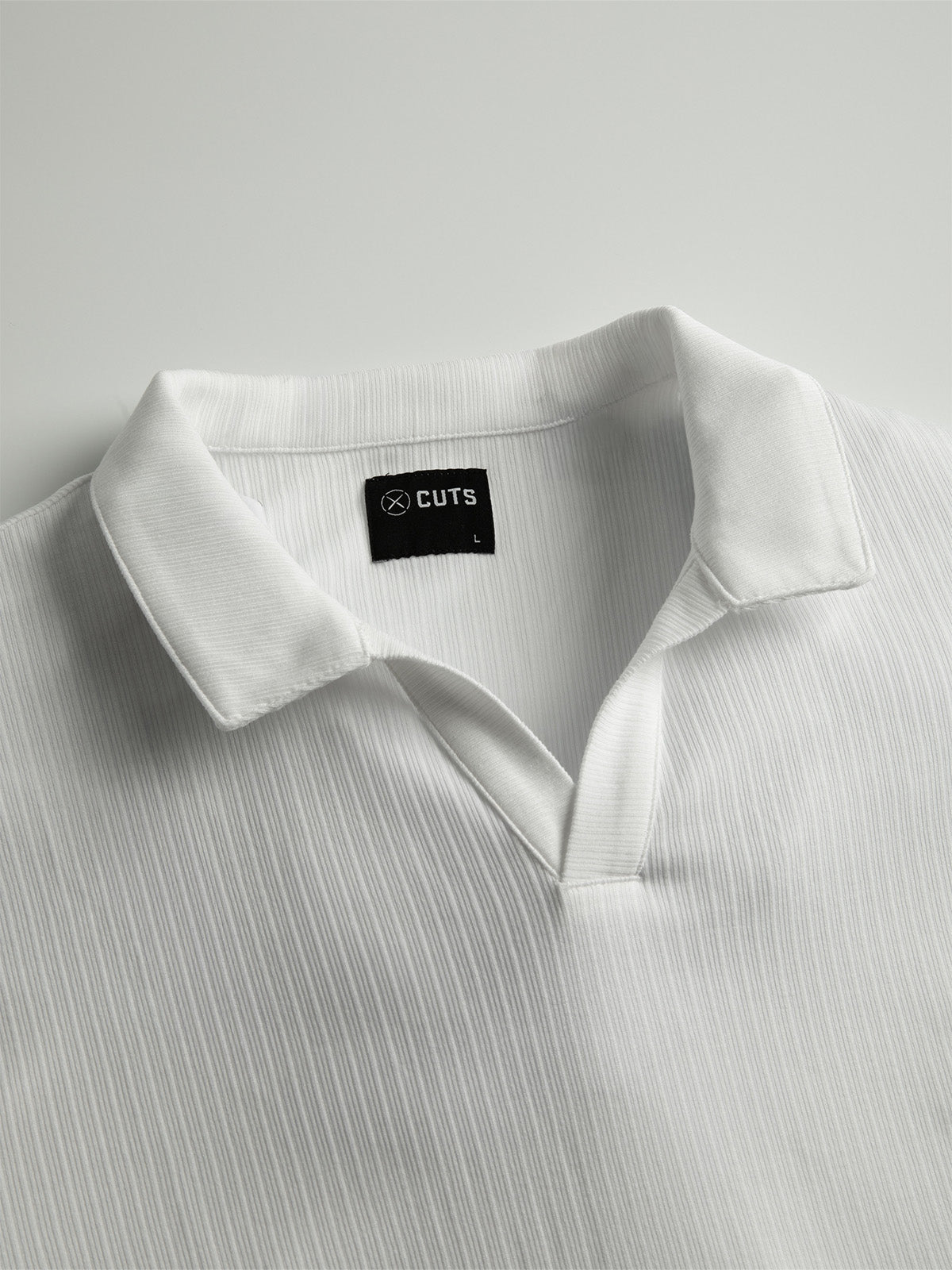 man wearing button down short sleeve dark black